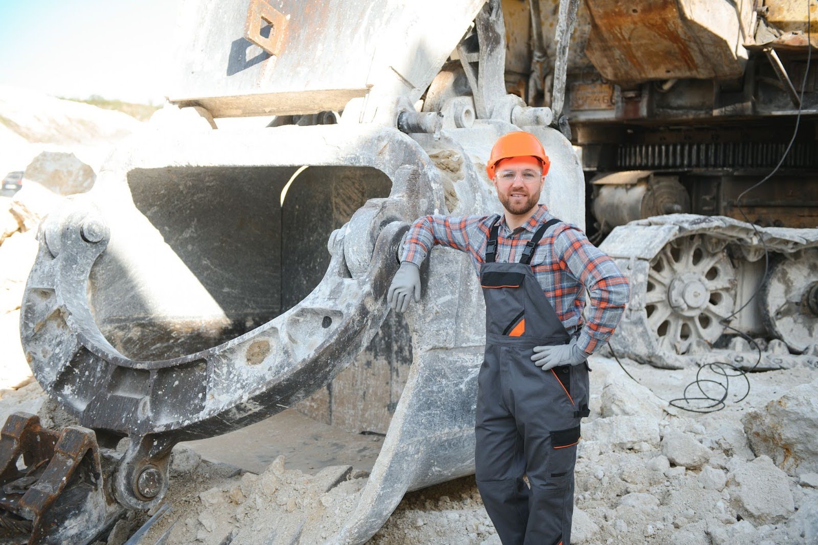 A demolition contactor standing next to a stone quarry.